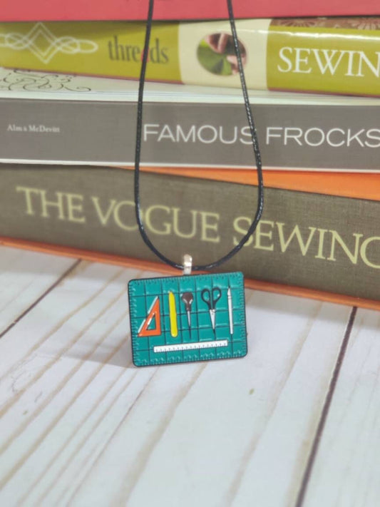 Sewing themed enamel pendants